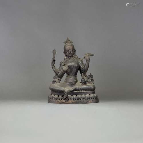 A BRONZE FIGURE OF GUANYIN