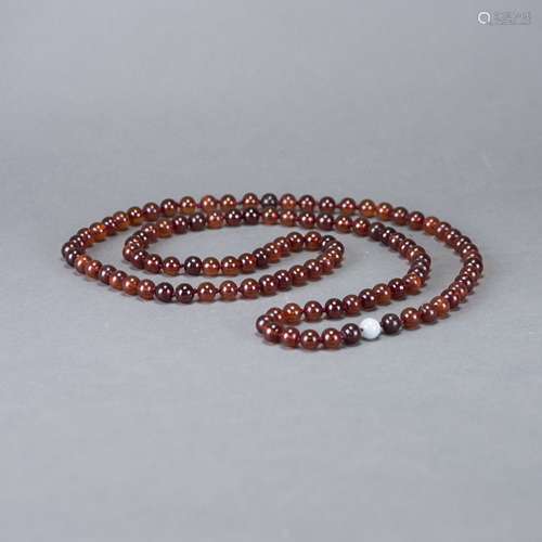 A STRING OF AMBER BEADS