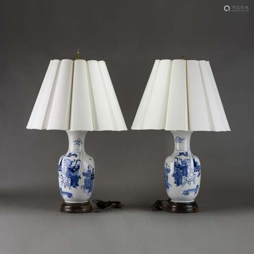 A PAIR OF BLUE AND WHITE 'FIGURAL' VASES, MOUNTED AS LAMPS