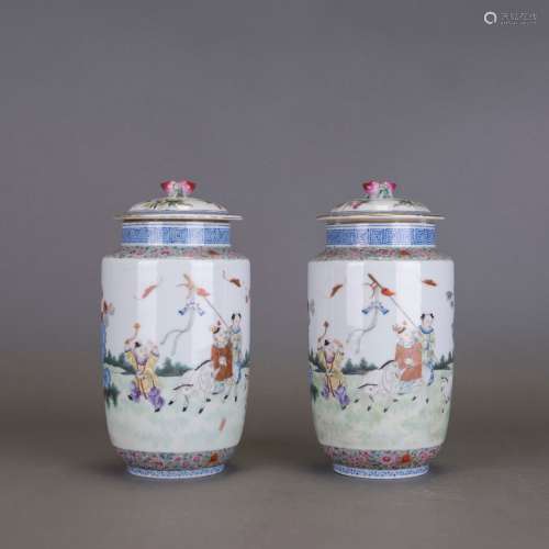 A PAIR OF FAMILLE ROSE 'BOYS' JARS AND COVERS