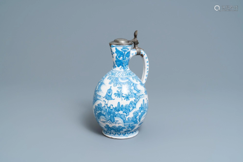 A large Dutch Delft blue and white chinoiserie jug with