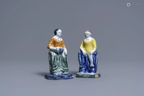 A pair of polychrome Dutch Delft figures of market