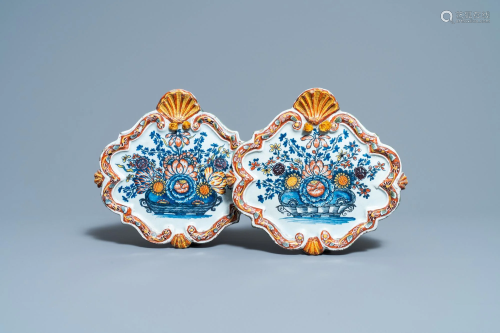 A pair of polychrome Dutch Delft 'flower basket'