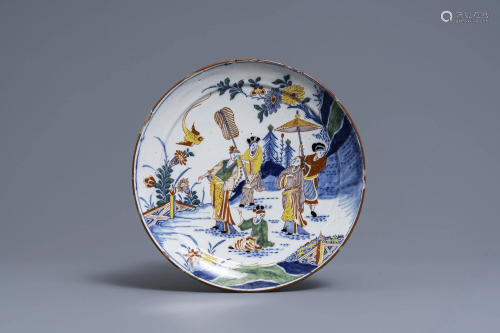 A polychrome Dutch Delft chinoiserie plate with figures