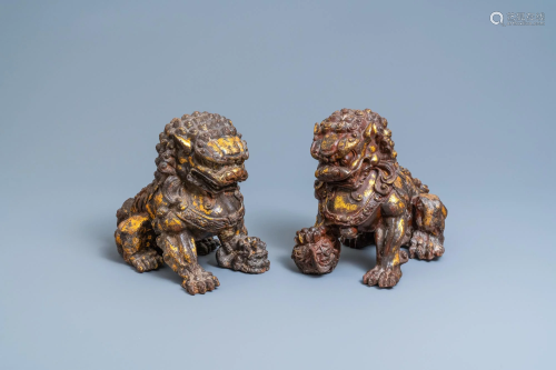 A pair of large Chinese gilt-lacquered iron models of
