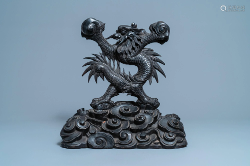 A large Chinese carved wooden 'dragon' stand for a dish