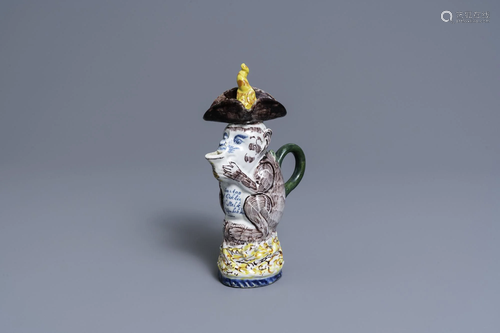 A polychrome Dutch Delft monkey ewer and cover, 18th C.