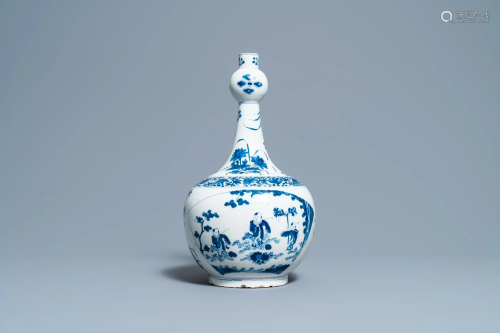 A Dutch Delft blue and white chinoiserie bottle vase in