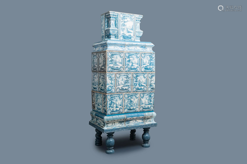 A composite stove with blue and white stove tiles,