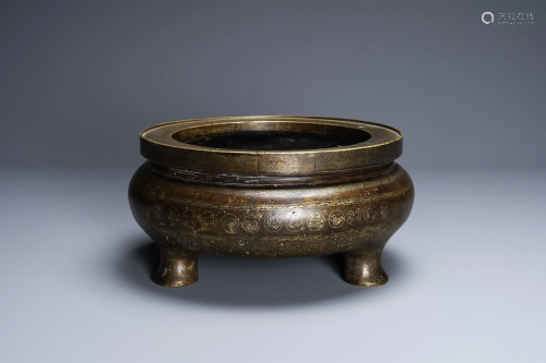 A Chinese parcel-gilt bronze tripod censer, Xuande