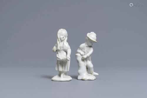 Two white Dutch Delftware figures of a boy and a girl,
