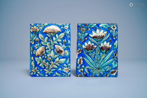 Two polychrome floral relief-moulded tiles, Qajar,