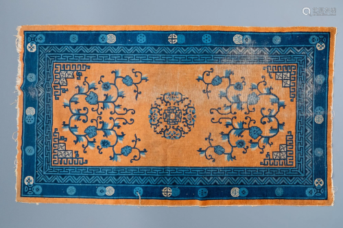 A large Chinese rectangular carpet, 19th C.