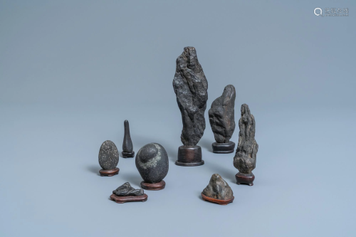 Eight Chinese scholar's rocks on wooden stands, 19/20th