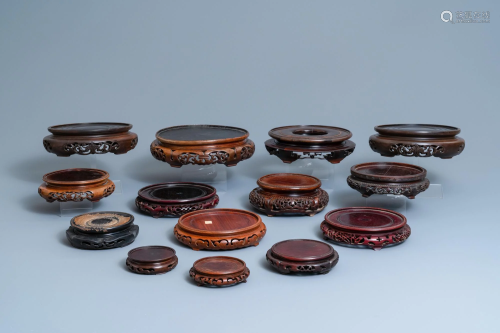 Fourteen Chinese reticulated round carved wooden