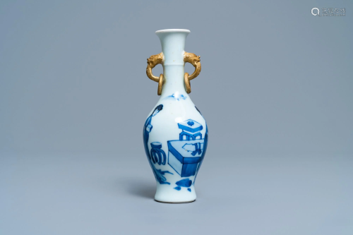 A Chinese blue and white vase with gilt elephant-head