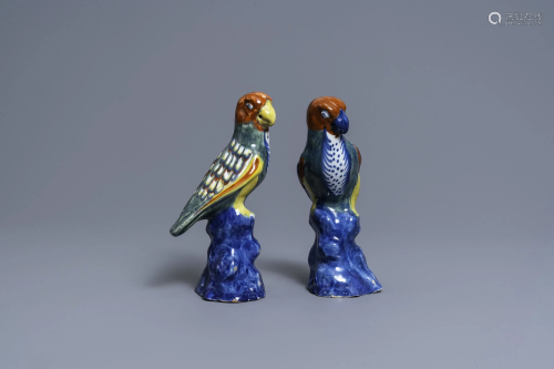 A pair of polychrome Dutch Delft models of parrots,