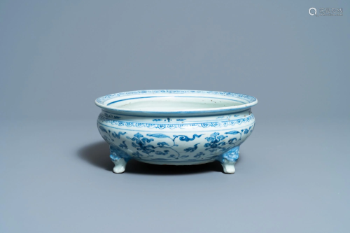 A Chinese blue and white tripod censer with floral