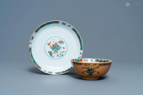 A Chinese capucine brown-ground famille verte plate and