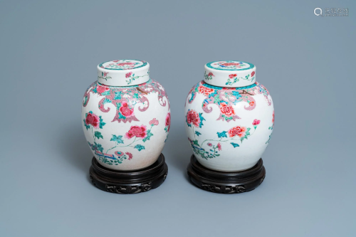A pair of Chinese famille rose jars and covers with