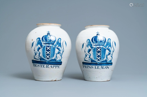 A pair of large Dutch Delft blue and white tobacco jars