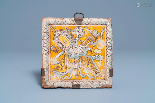 A maiolica floor tile with weapons and armoury, Italy