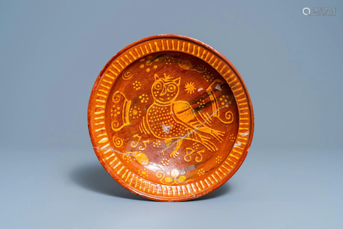 A Dutch slip-decorated pottery dish with an owl, dated