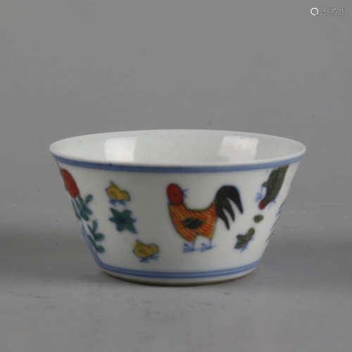 An underglaze-blue and enameled rooster cup