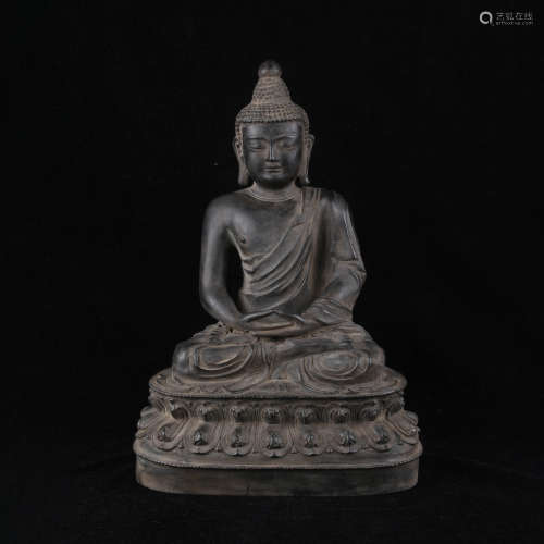 A bronze seated buddha statue