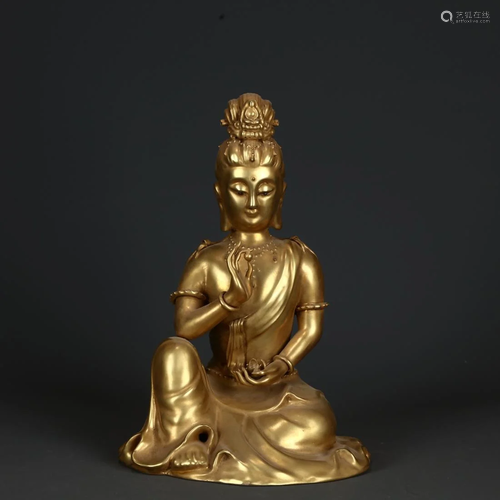 A GILT PORCELAIN FIGURINE OF GUANYIN