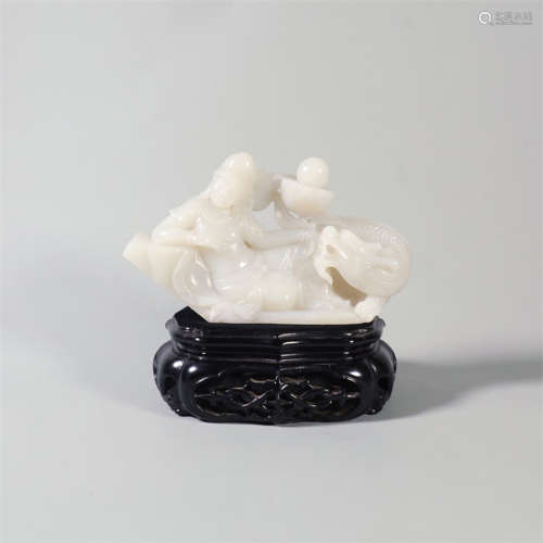 A hetian jade carving of guanyin riding a dragon