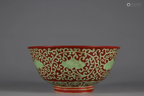 RED GROUND BOWL WITH INTERLOCKING GREEN FOLIAGE