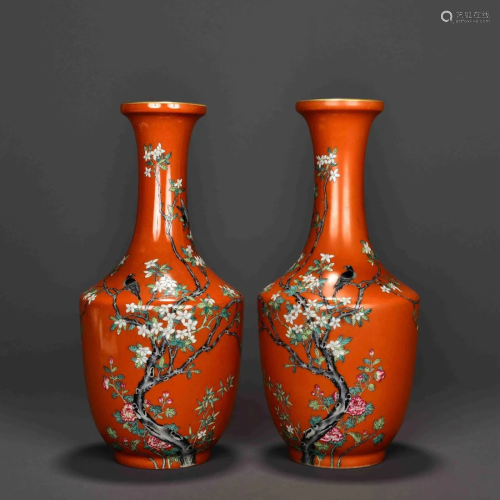 A PAIR OF RED GROUND FAMILLE ROSE VASES