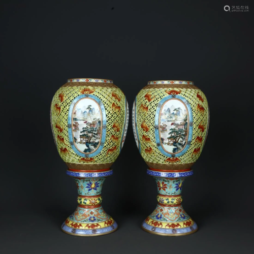 A PAIR OF JAUNE GROUND FAMILLE ROSE CANDLESTICKS