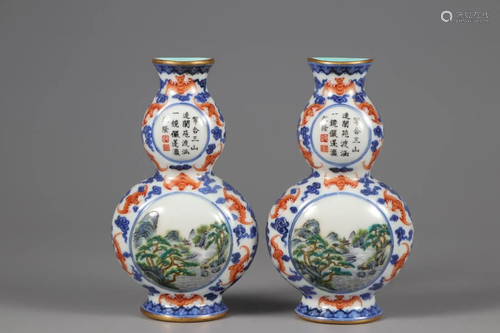 A PAIR OF BLUE AND WHITE RED IRON WALL VASES