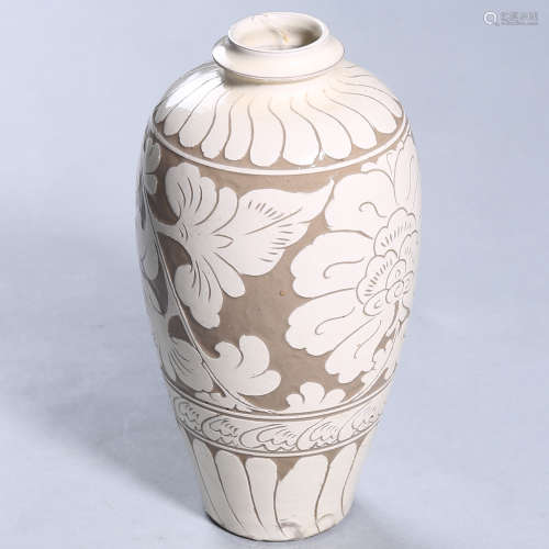 An incised white-glazed floral pottery vase
