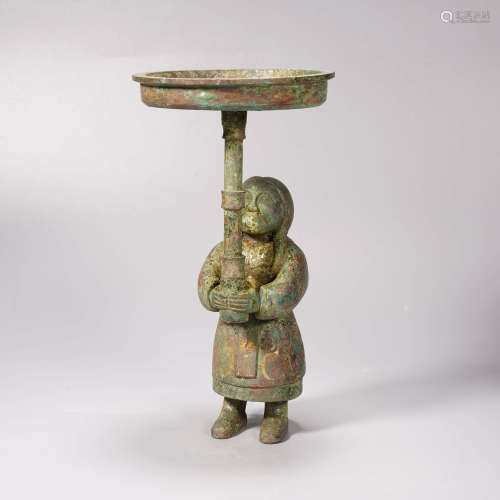 An archaistic style silver and gold inlaid figural candlesti...