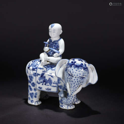 A blue and white child riding elephant ornament