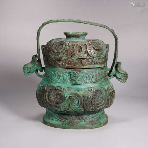 An archaistic style bronze phoenix loop-handle vessel, you