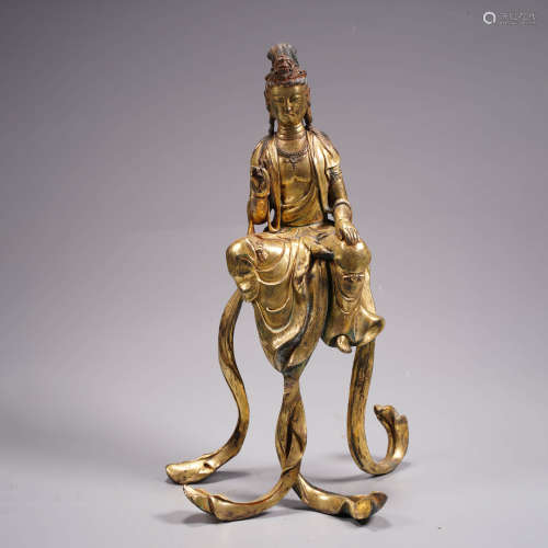 An archaistic gilt bronze statue of avalokitesvara