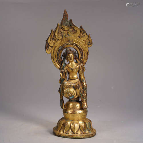 A tang style gilt bronze statue of avalokitesvara