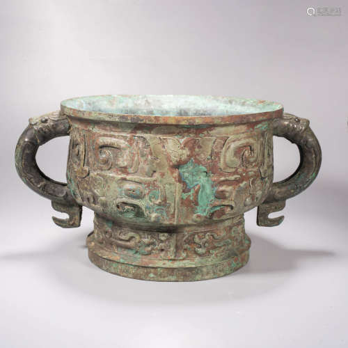 An archaistic style bronze beast-face double-eared vessel, g...