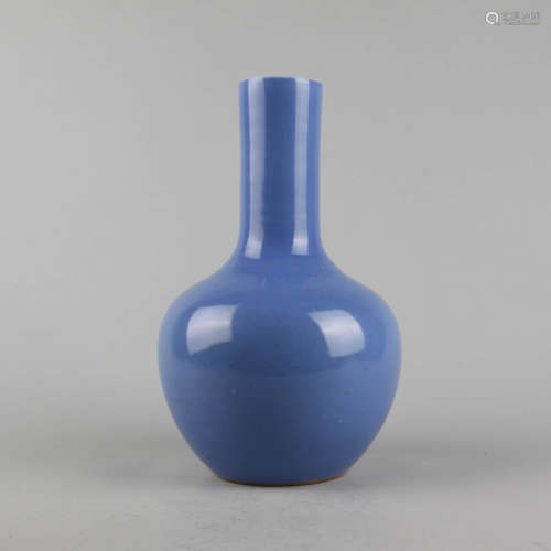 A blue-glazed bottle vase