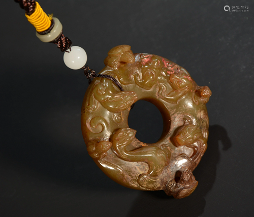 A Carved Jade Dragon Bi