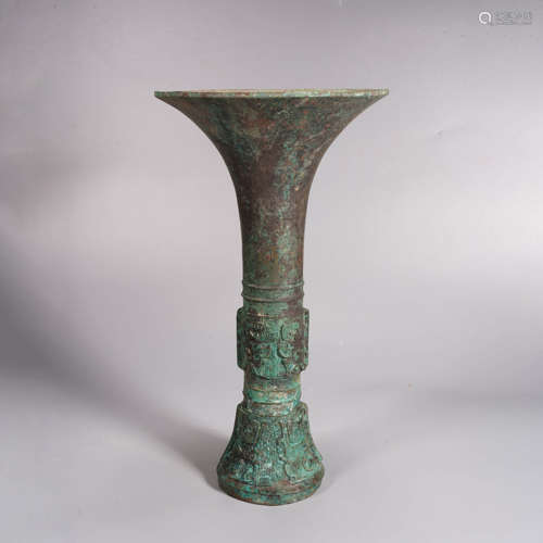 An archaistic style bronze beast-face beaker vase