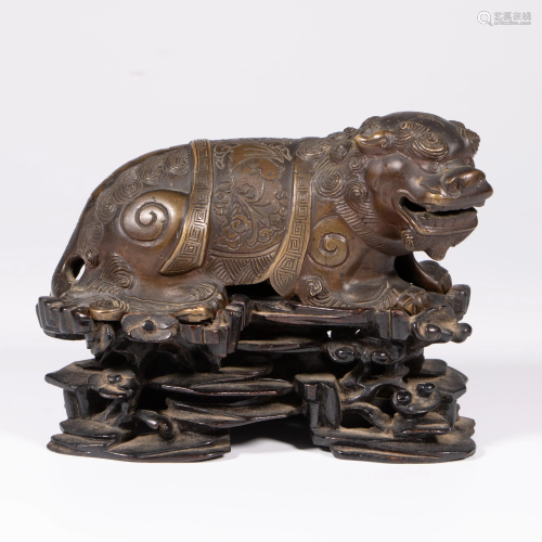 QING BRONZE QILIN FORM ORNAMENT ON STAND
