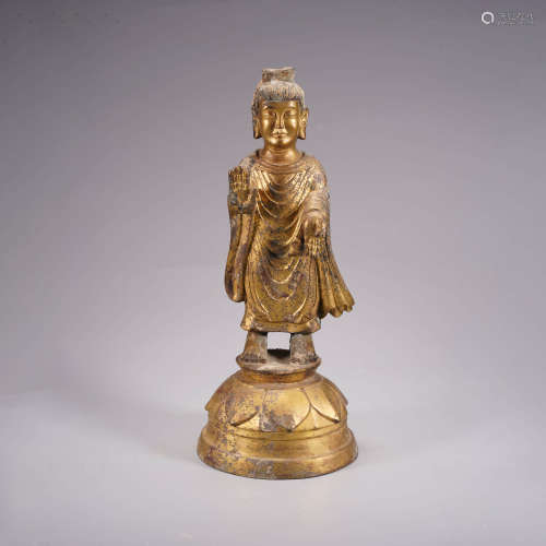 A gilt bronze statue of buddha