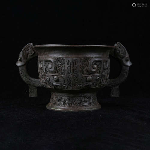 An archaistic style bronze beast-face double-eared vessel, g...