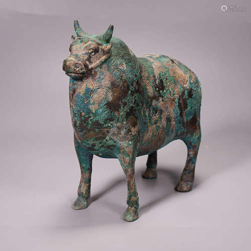 An archaistic style bronze ox ornament