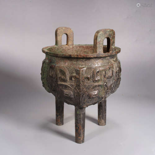 An archaistic style bronze beast-face tripod vessel, ding